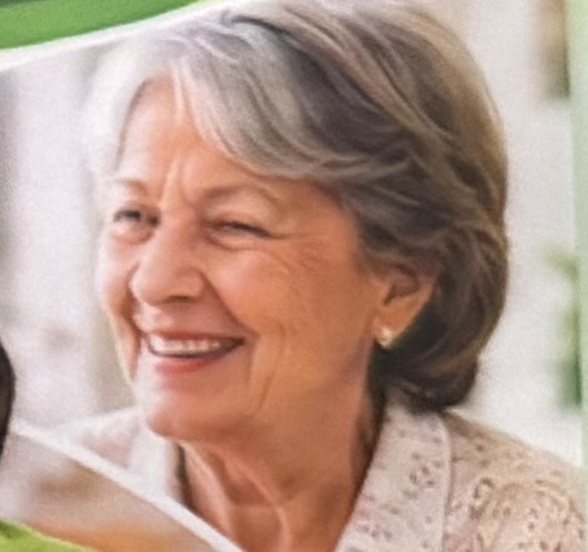 A senior woman smiling at home